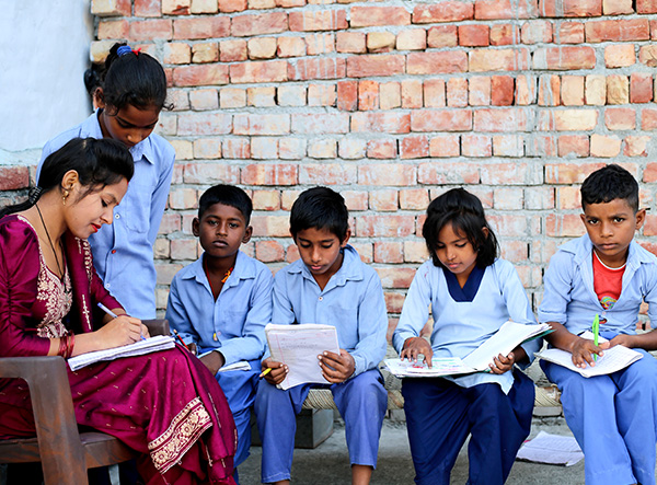 Children studying as part of CAMS education CSR initiative